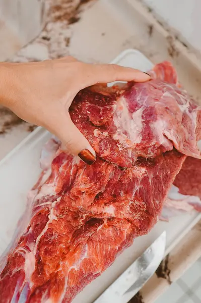 Piece of raw red beef chuck meat with fat. Brazil is the second largest producer and largest exporter of beef in the world.