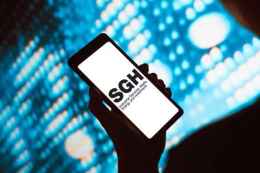 19 Şubat 2024, Brezilya. Bu resimde, Seven Group Holding Limited (SGH) logosu akıllı telefon ekranında gösteriliyor