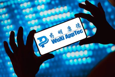 April 1, 2024, Brazil. In this photo illustration, the WuXi AppTec logo is displayed on a smartphone screen clipart