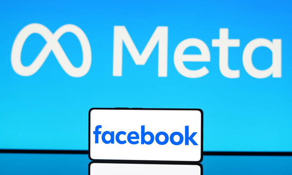 May 6, 2024, Brazil. In this photo illustration the Facebook logo is displayed on a smartphone screen and in the background, Meta Platforms logo