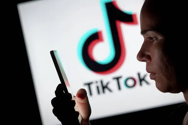 May 2024 Brazil Photo Illustration Woman Holding Smartphone Tiktok Logo Stockbild
