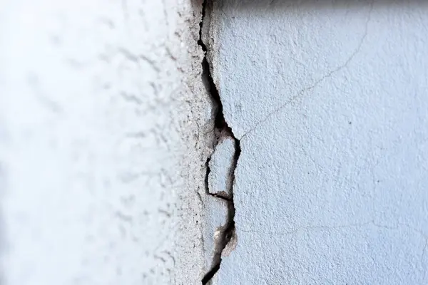 stock image June 30, 2024, Paraguay. In this photo illustration, crack in the wall. Cracks can be caused by soil movement, inadequate structural load, climate variations, natural wear and tear and even construction errors