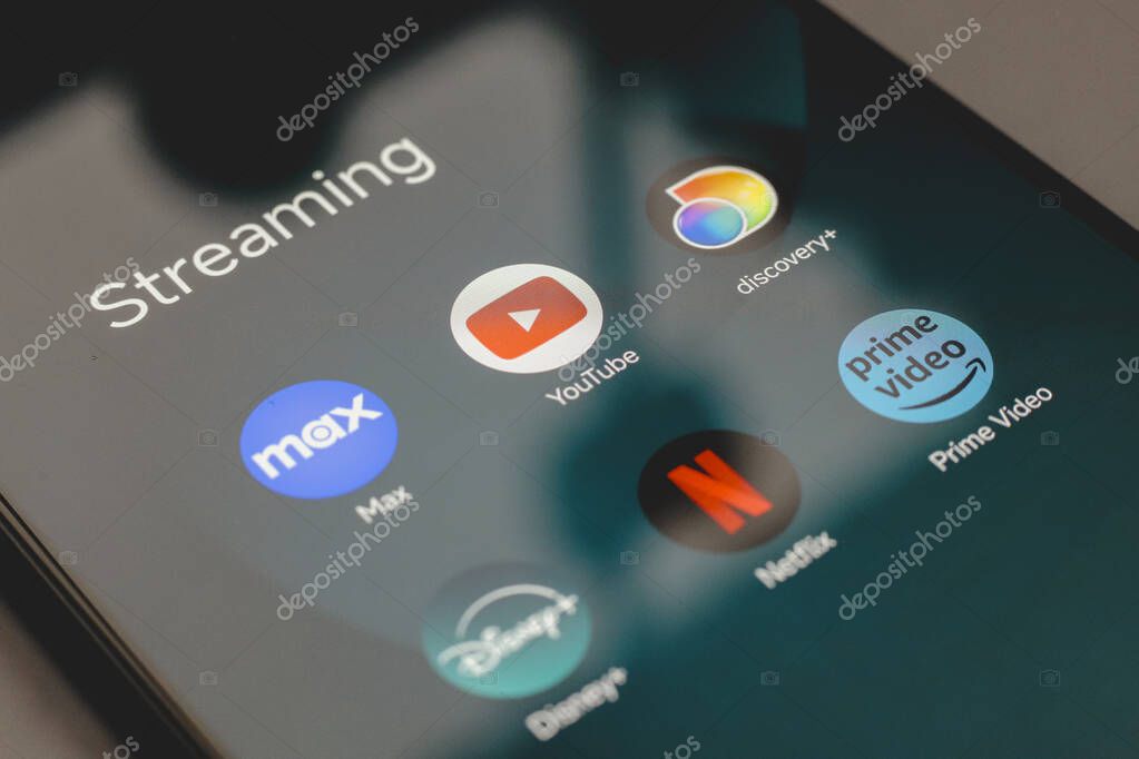 July 9, 2024, Paraguay. In this photo illustration, the app logo Max, YouTube, Discovery, Disney, Netflix and Prime Video is displayed on a smartphone screen