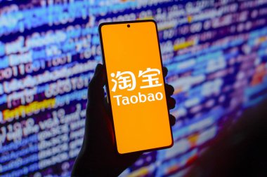 July 25, 2024, Paraguay. In this photo illustration, the Taobao logo is displayed on a smartphone screen clipart