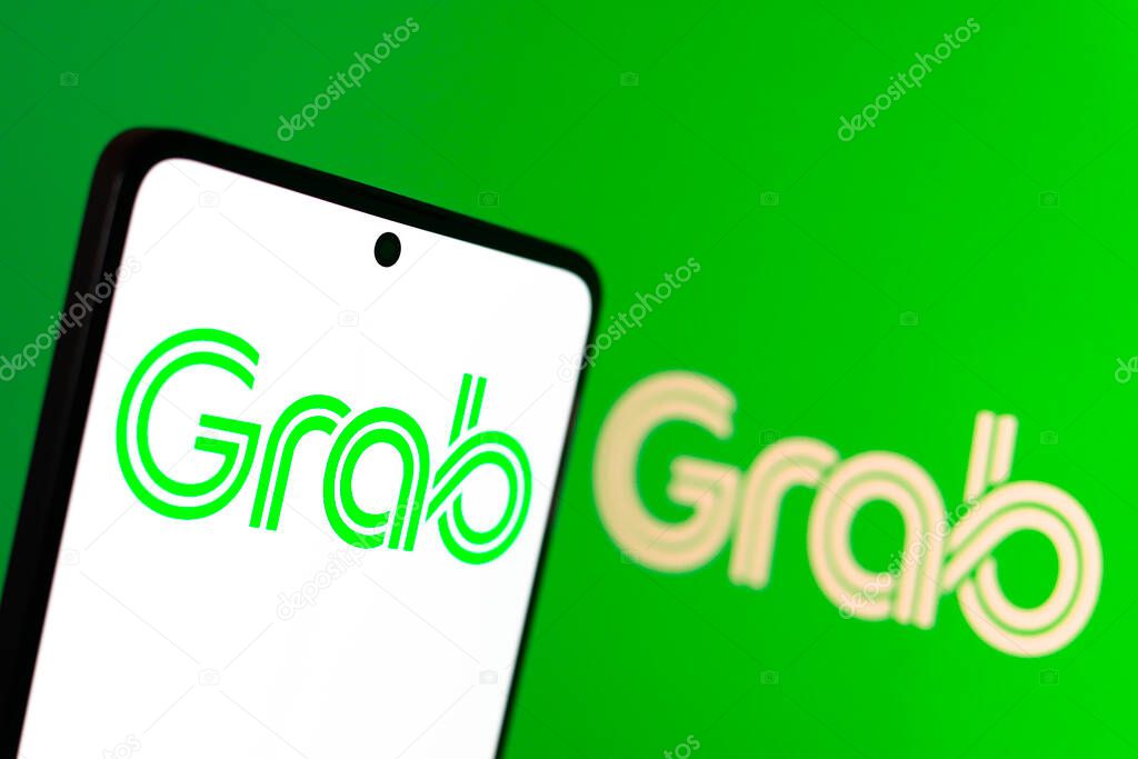 August 16, 2024, Paraguay. In this photo illustration, the Grab Holdings Limited logo is displayed on a smartphone screen