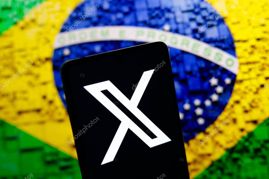 August 17, 2024, Paraguay. In this photo illustration, the X (Twitter) logo is displayed on a smartphone screen and the flag of Brazil in the background. Social network X announces that it will close its office in Brazil