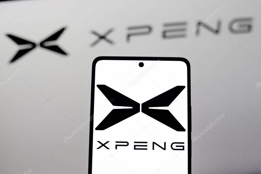 August 26, 2024, Paraguay. In this photo illustration, the XPeng Inc. logo is displayed on a smartphone and in the background