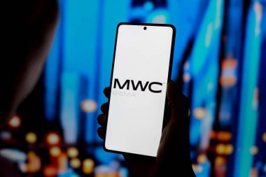 August 27, 2024, Paraguay. In this photo illustration, the Mobile World Congress (MWC GSMA) logo is displayed on a smartphone screen clipart