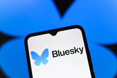 The logo of the social network Bluesky is displayed on the screen of a smartphone, in Reno, United States, on November 20, 2024 clipart