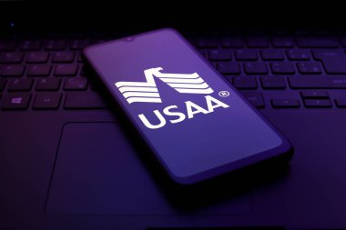 The United Services Automobile Association (USAA) logo appears on the screen of a smartphone, in Reno, United States, on November 30, 2024. clipart