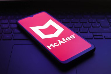 The McAfee logo appears on the screen of a smartphone, in Reno, United States, on December 1, 2024 clipart