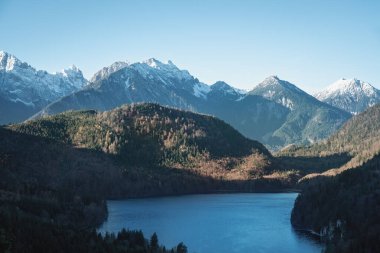 Aerial view of Alpsee lake with Alps Tannheim Mountains - Schwangau, Bavaria, Germany