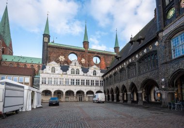 Lubeck, Germany - Jan 10, 2020: Lubeck Town Hall Market with Renaissance Arbor, Gothic Shield Wall and Long House - Lubeck, Germany