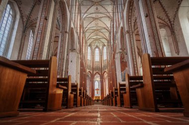 Lubeck, Germany - Jan 10, 2020: Main Aisle and Altar at St. Mary Church (Marienkirche) Interior - Lubeck, Germany