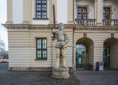 Magdeburg, Germany - Jan 15, 2020: Magdeburger Roland Statue in front of Magdeburg Old City Hall - Magdeburg, Saxony-Anhalt, Germany