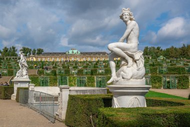 Potsdam, Germany - Sep 13, 2019: Marble Sculpture of God Apollo at Sanssouci Palace Gardens - Potsdam, Brandenburg, Germany