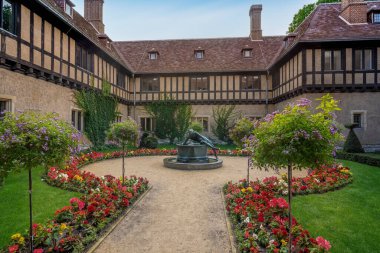 Potsdam, Germany - Sep 13, 2019: Princes Courtyard and Narcissus fountain at Cecilienhof Palace - Potsdam, Brandenburg, Germany