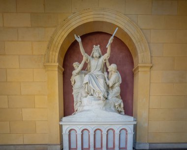 Potsdam, Germany - Sep 13, 2019: Moses in prayer supported by the high priests Aaron and Hur Sculpture at Church of Peace (Friedenskirche) - Potsdam, Brandenburg, Germany clipart