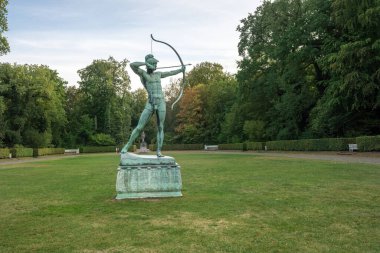 Potsdam, Germany - Sep 13, 2019: Apollo the Archer Statue at Sanssouci park - Potsdam, Brandenburg, Germany