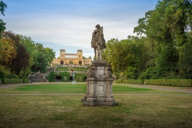 Potsdam, Germany - Sep 13, 2019: Sanssouci park view with  Orangery Palace, Frederick the Great and Apollo Statues - Potsdam, Brandenburg, Germany
