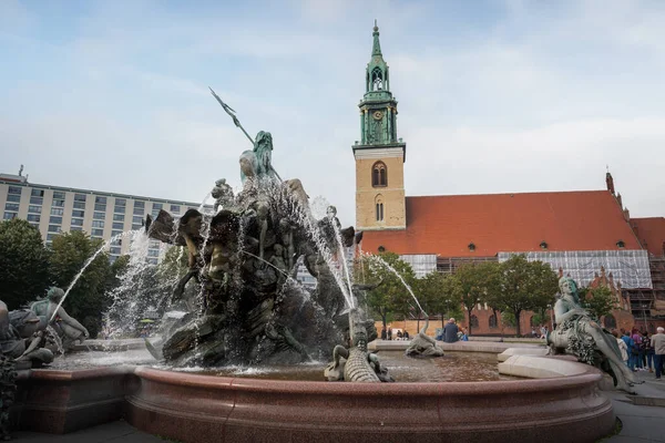 stock image Neptune Fountain and St. Mary Church (fountain designed by Reinhold Begas in 1891) - Berlin, Germany