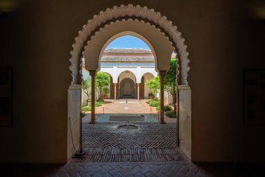 Malaga, Spain - May 18, 2019: Patio de los Naranjos (Orange Tree Courtyard) in Nasrid and Taifa Palace at Alcazaba Fortress - Malaga, Andalusia, Spain clipart