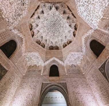 Granada, Spain - Jun 5,  2019: Ceiling with Muqarnas in the Hall of the Two Sisters (Sala de las Dos Hermanas)  at Nasrid Palaces of Alhambra - Granada, Andalusia, Spain clipart