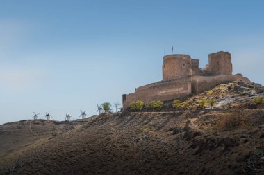 Consuegra Castle (Castle of La Muela) and Windmills at Cerro Calderico - Consuegra, Castilla-La Mancha, Spain clipart