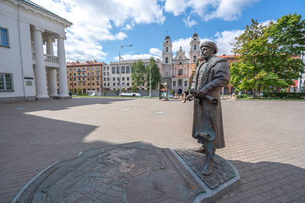 Minsk, Belarus - Jul 31, 2019: Statue of City Voit (magistrate) with key and royal letter in front of Minsk City Hall - Minsk, Belarus