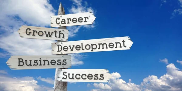Career, development, growth, business, success - wooden signpost with five arrows
