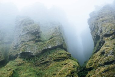 Rocks and fog at Raudfeldsgja Gorge on Snaefellsnes Peninsula in Iceland