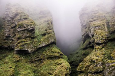Rocks and fog at Raudfeldsgja Gorge on Snaefellsnes Peninsula in Iceland