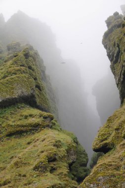 Rocks and fog at Raudfeldsgja Gorge on Snaefellsnes Peninsula in Iceland