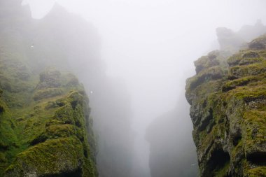 Rocks and fog at Raudfeldsgja Gorge on Snaefellsnes Peninsula in Iceland
