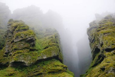 Rocks and fog at Raudfeldsgja Gorge on Snaefellsnes Peninsula in Iceland