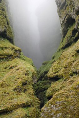 Rocks and fog at Raudfeldsgja Gorge on Snaefellsnes Peninsula in Iceland