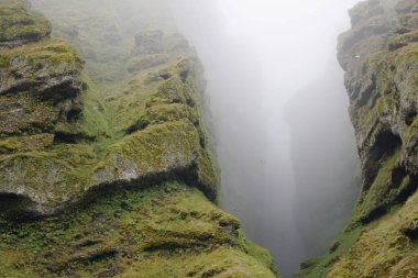 Rocks and fog at Raudfeldsgja Gorge on Snaefellsnes Peninsula in Iceland