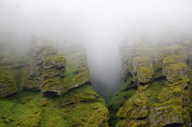 Rocks and fog at Raudfeldsgja Gorge on Snaefellsnes Peninsula in Iceland