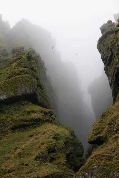Rocks and fog at Raudfeldsgja Gorge on Snaefellsnes Peninsula in Iceland