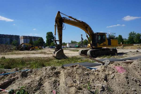 stock image Warsaw, Poland, June 26th 2022 - Yellow excavator on construction site