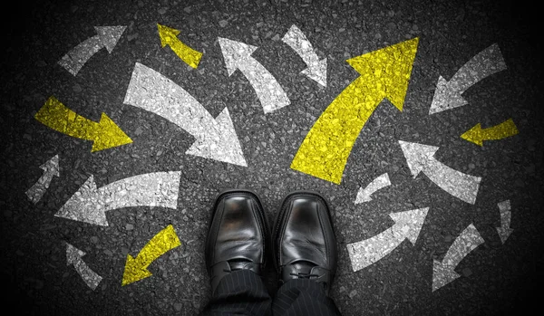 stock image Black business shoes and many chalky arrows in various directions - chaos concept