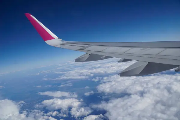 Stock image Plane wing and clouds - flying