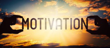 Motivasyon - insan elleri siyah siluet kelime tutuyor