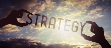 Strateji - insan eli siyah siluet kelime tutuyor