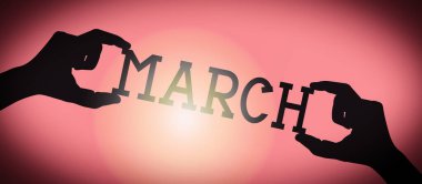 March - human hands holding black silhouette word, gradient background clipart
