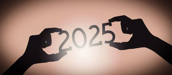 2025年 黒のシルエット年番号 グラデーション背景を持つ人間の手 — ストック写真