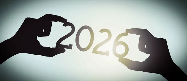 2026年 黒のシルエット年番号 グラデーション背景を持つ人間の手 — ストック写真