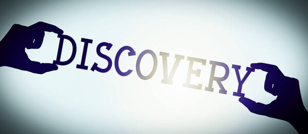 Discovery - human hands holding black silhouette word, gradient background