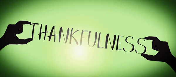 Thankfulness Human Hands Holding Black Silhouette Word Gradient Background — Stock Photo, Image