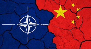 Flags of NATO and China on cracked surface - politics, relationship concept clipart